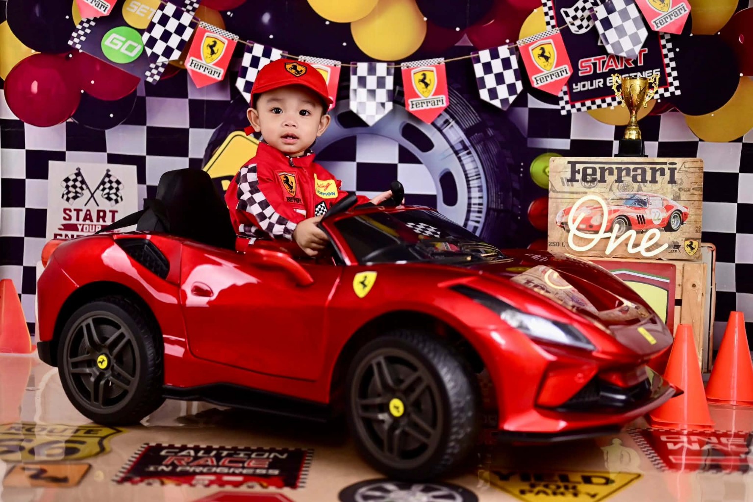 Thirdy in his little red racing outfit